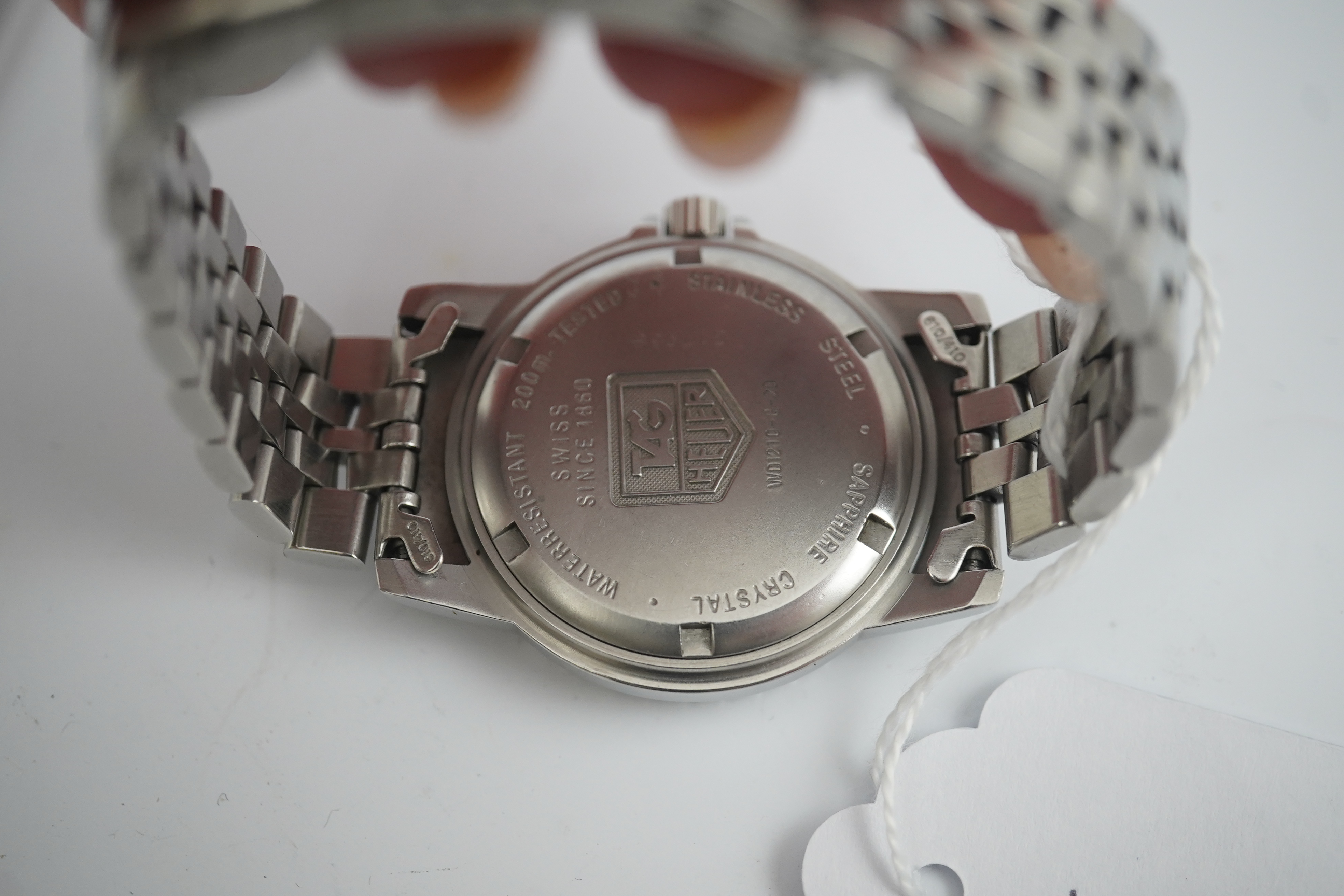 A gentleman's recent stainless steel Tag Heuer Professional quartz wrist watch, on a Tag Heuer stainless steel bracelet